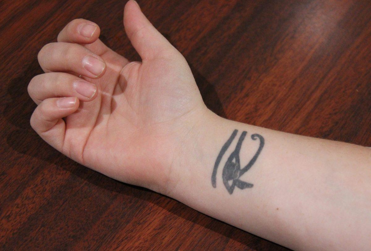 Maggie Sessoms sports the Eye of Ra on her wrist. Sessoms got the tattoo because it means protection.