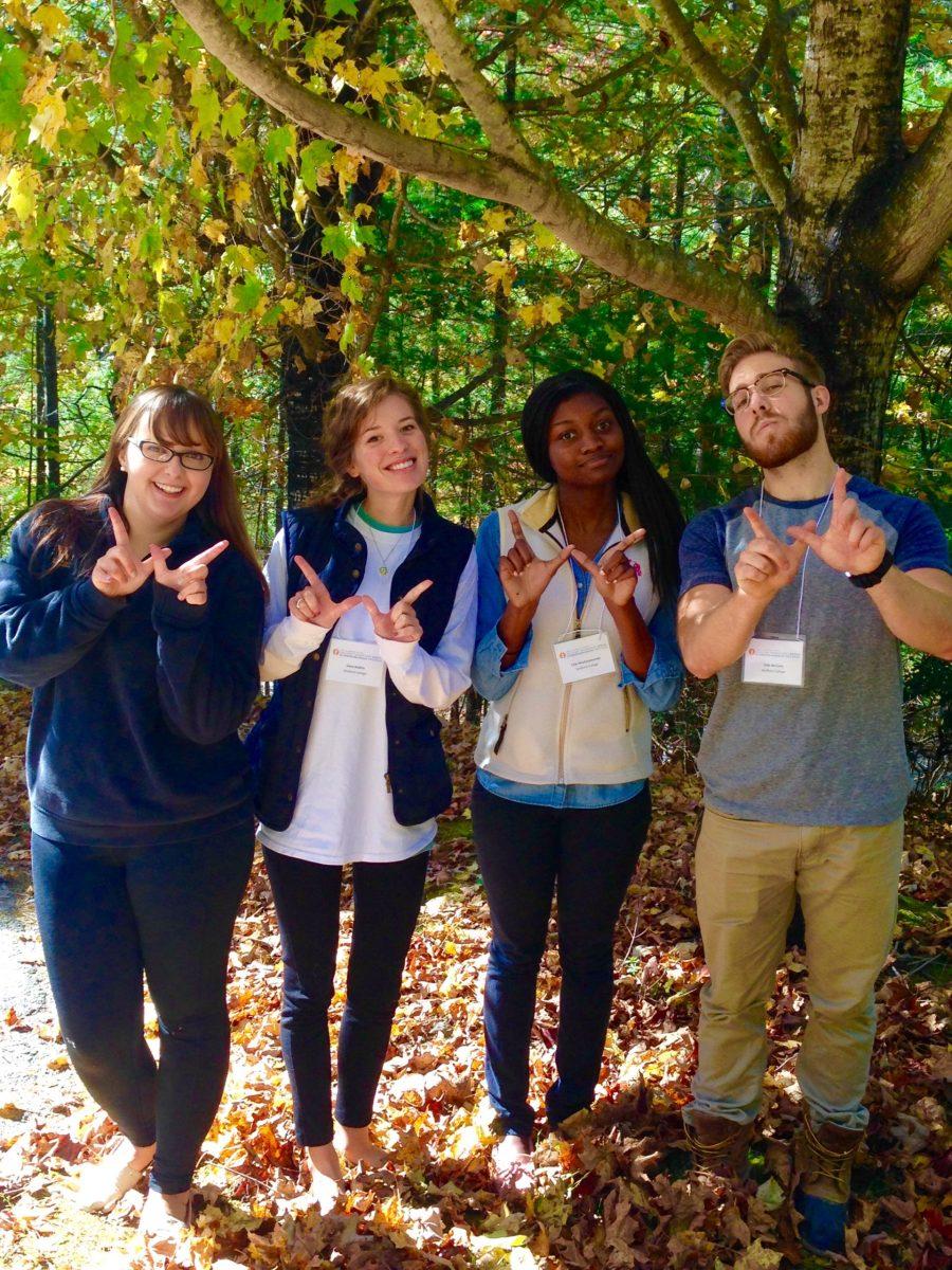 Pellon, Nobles, Mushayamunda and McCarty throw up a W to represent Wofford at the conference. 