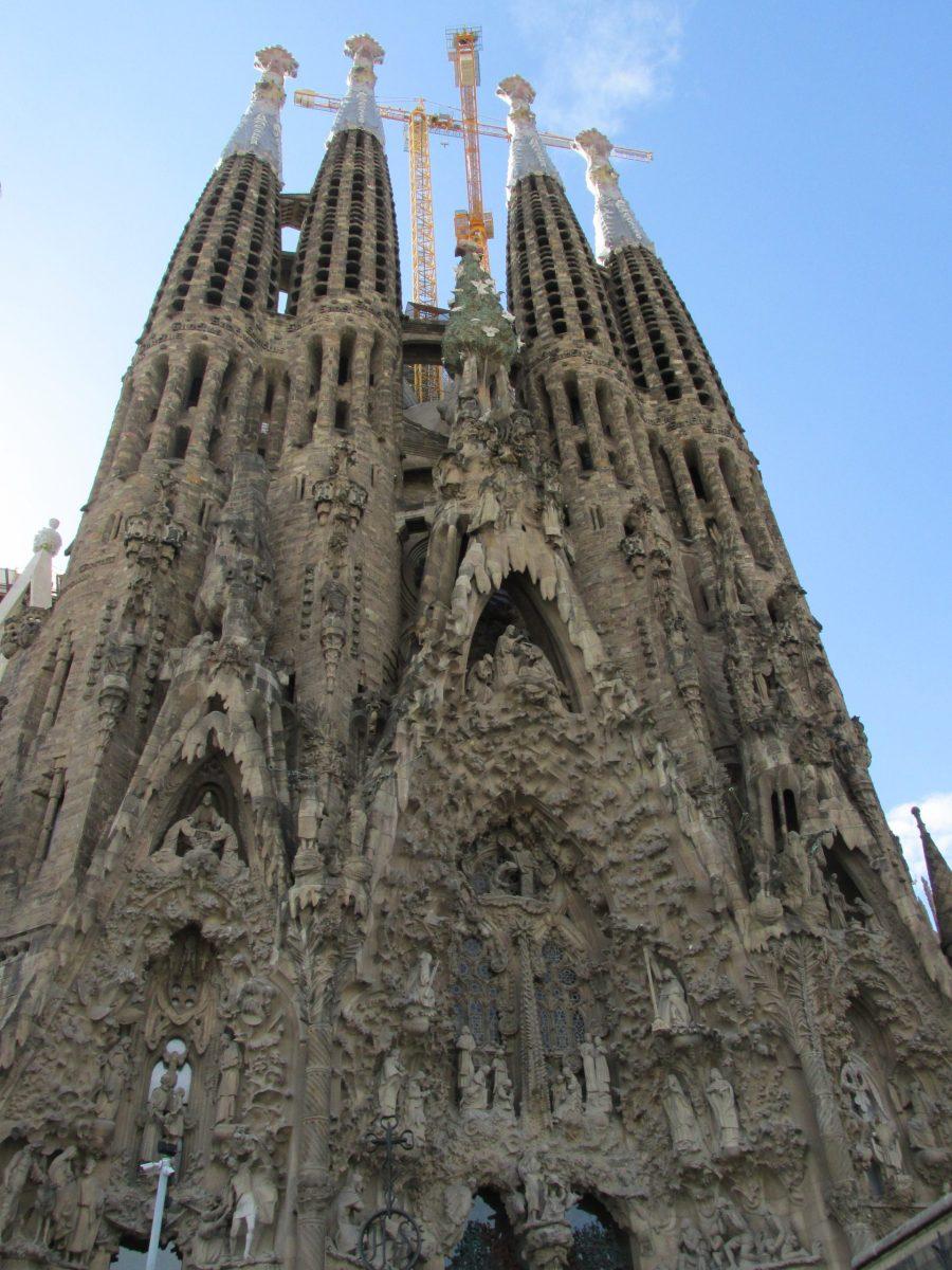 The Sagrada Família towers over Barcelona. Designed by Gaudi, it is still under construction long after his death.