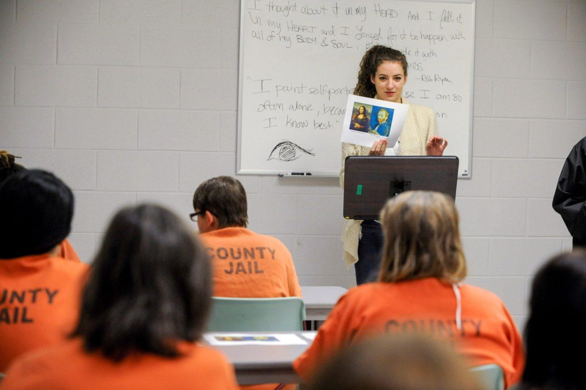 Katie Harmon teaching art class at a local county jail.