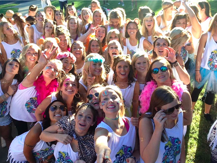 Members of Zeta Tau Alpha await their new sisters outside of Anna Todd on Campus Drive.  
