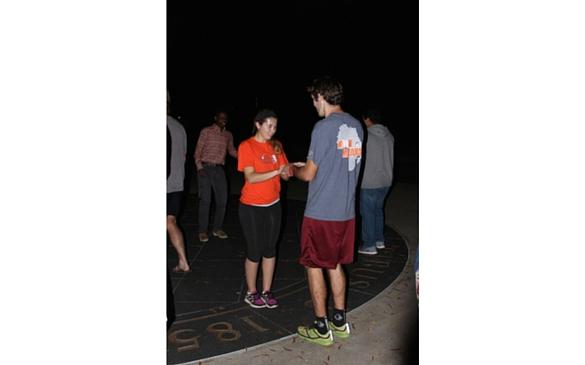 Cross country team members KJ Atwood and Mollie Golicher take a break from running to try their hands at salsa.