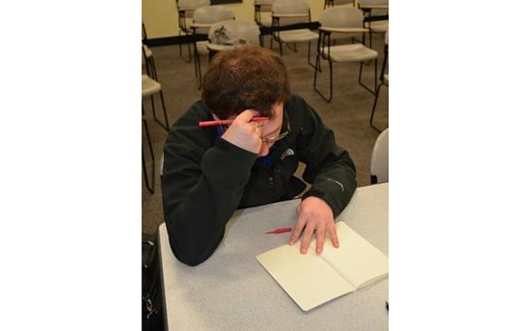 Kevin Emery, ’16, attempts to finish an assignment in spite of the everyday life as a senior.