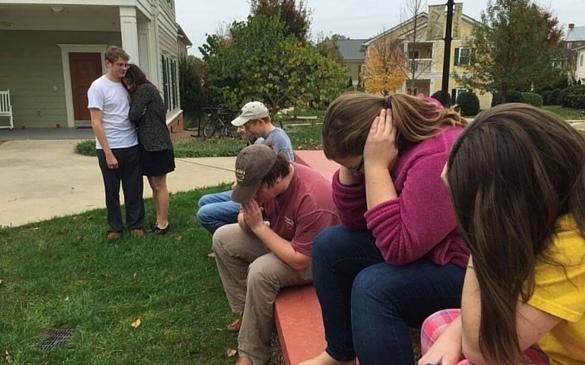 Students huddled outside one Sunday morning after a fire alarm displaced them from apartment 318.
