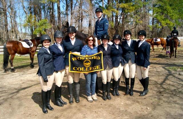 The team poses with rider Crawford Anderson as he gets ready to go into the ring for his class at the recent Charleston competition.