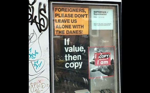 A sign posted on a building outside of Copenhagen’s city center shows the feelings that some minorities have toward ethnic Danes.