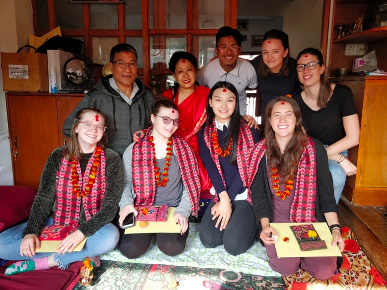 Sadie Fink with her host family in Nepal after having a tikka ceremony