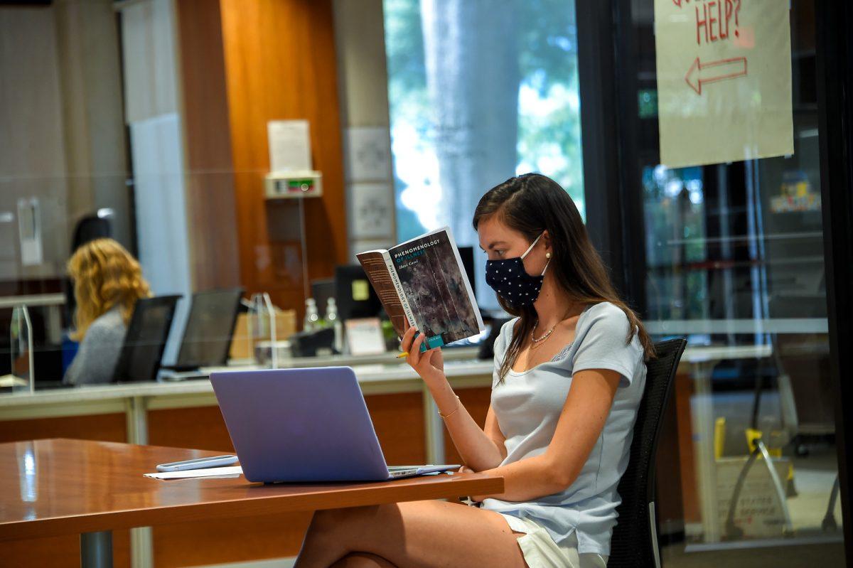 A student reading in the library.