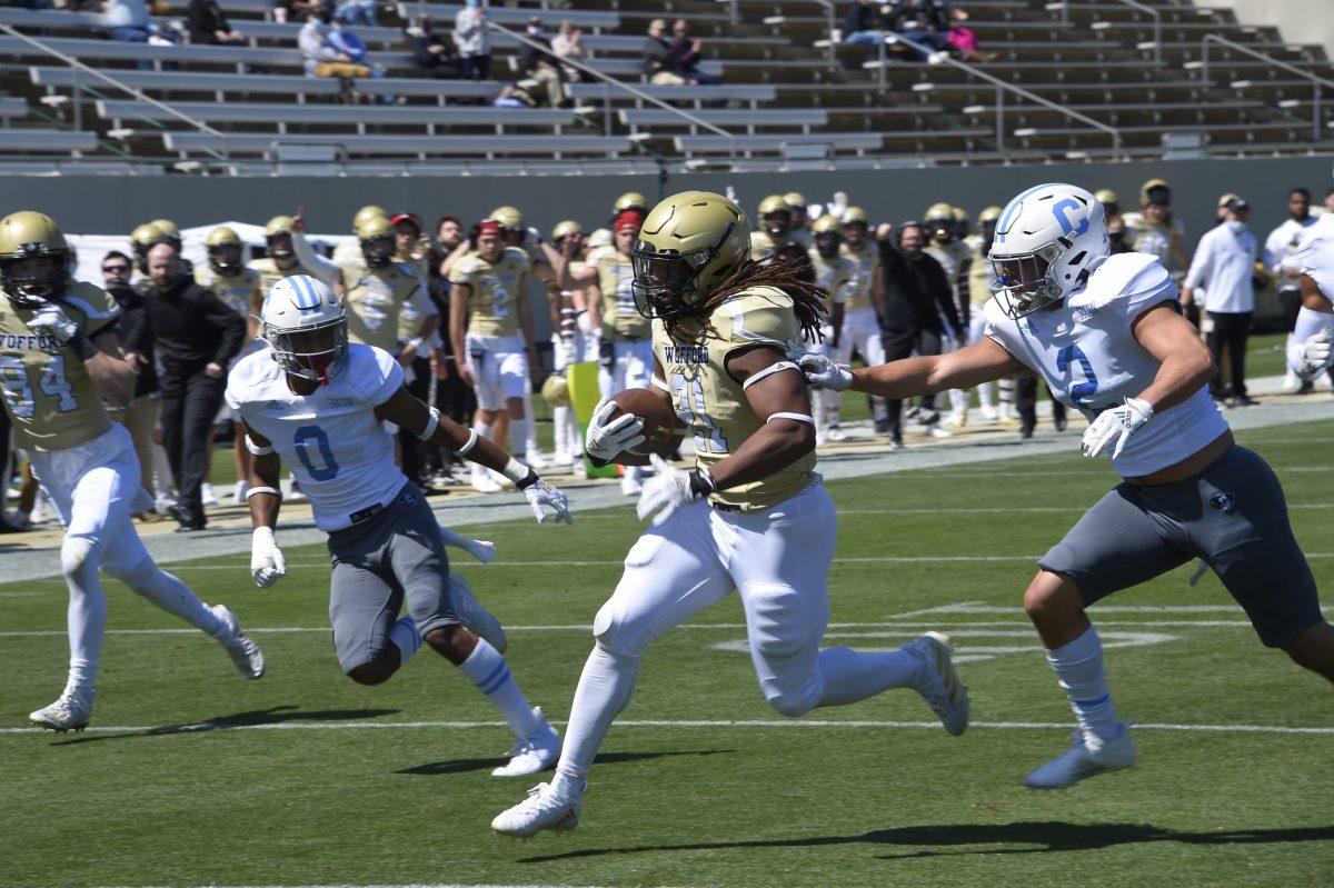 Wofford running back Nathan Walker (21) scores a second half touchdown vs. the Citadel. Walker’s touchdown would be Wofford’s last of the season. Photo courtesy of Mark Olencki.