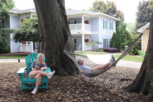 Payton Simmons ‘22 and Matthew Shouse ‘23 relaxing between classes in the Senior Village. Spending a few minutes outdoors with friends is one way students can relax. Photo courtesy of Anna Lee Hoffman.