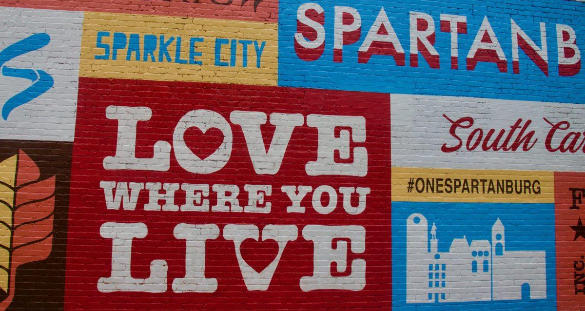 Pictured is the well-known “Love Where You Live” mural in downtown Spartanburg. Loving where you live takes acknowledgement and support for the community. Photo by Paulina Veremchuk