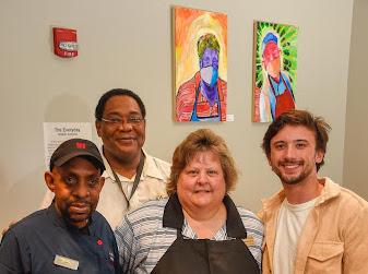 Walker Antonio ‘23 with Zach’s employees featured in his paintings. Antonio completed this project for one of his art classes at Wofford.