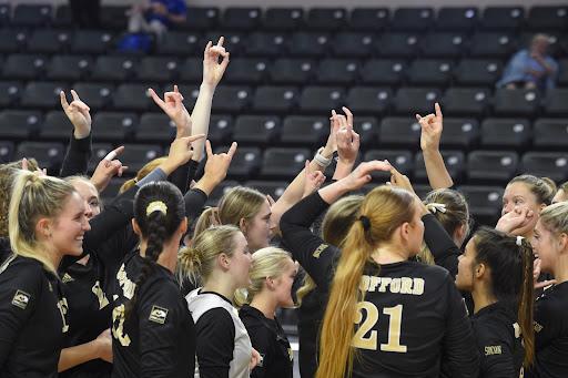 Photo courtesy of Mark Olencki
Wofford Women’s Volleyball Team huddles during a Fall 2022 semester game against the Citadel. This shows the team power and the family energy, a common thread within sports teams at Wofford.