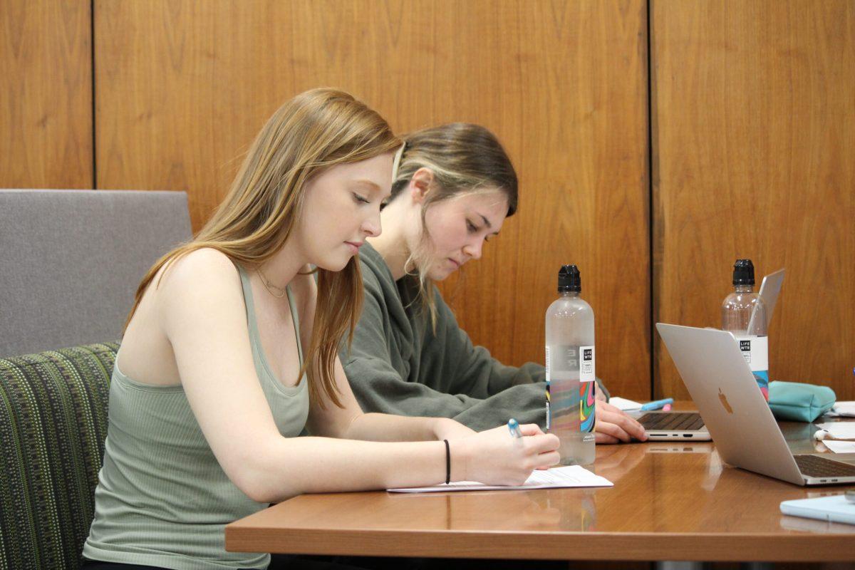 Photo by Hailey Hirter -
Abby Herpel ‘26 and Allison Lehman ‘25 study upstairs in the library. Students are able to use the library as a tool to study.
