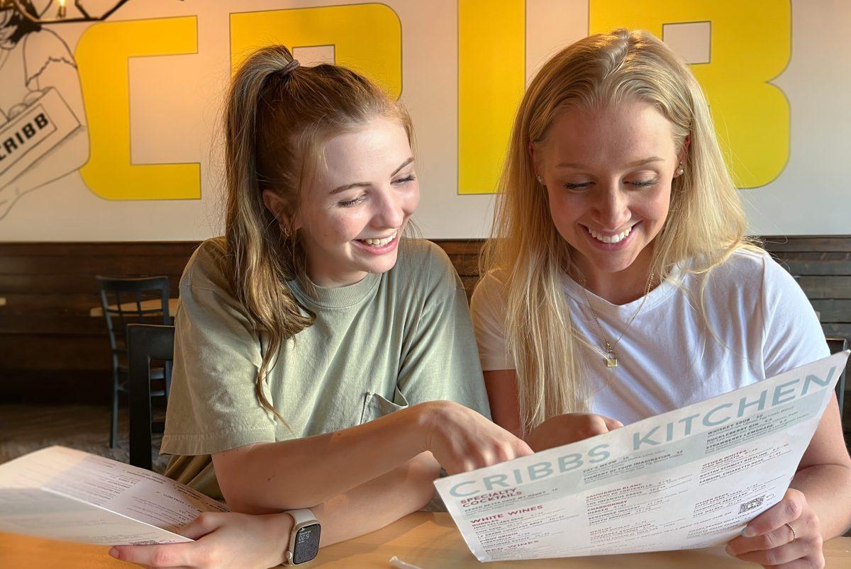 Photo by Haley Hirter - Anna Cooper ‘25 and Hannah Hyatt ‘26 read the menu at Cribbs Kitchen.
Students are able to use their Terrier Bucks off campus at restaurants such as
Cribbs Kitchen.