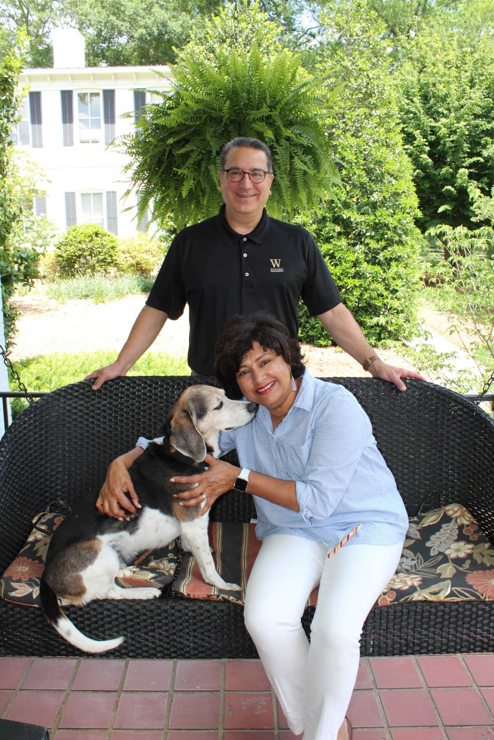 Photo by Addie Porter - President Nayef Samhat and Prima Samhat on their porch with their beloved dog, Ava. This year marks the Samhats 10th year at Wofford College.