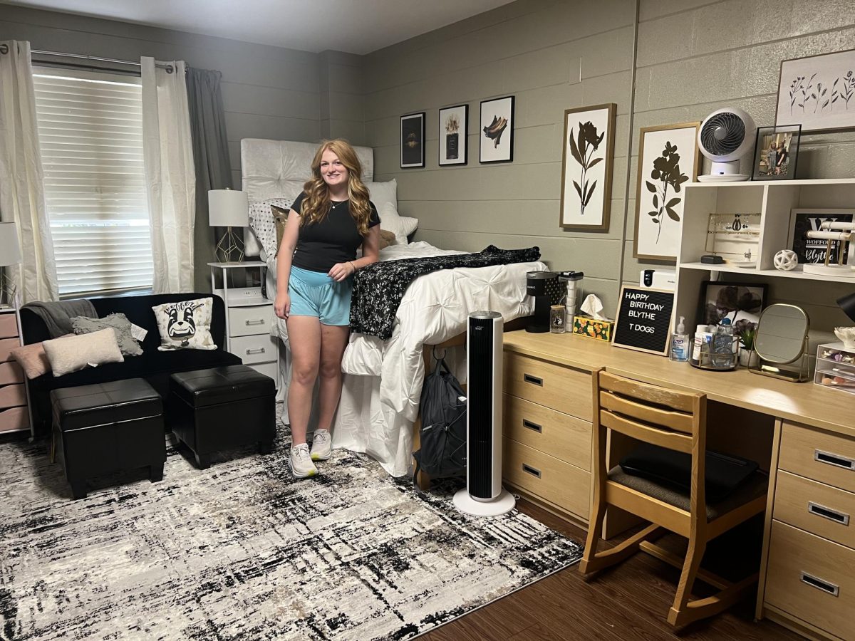 Blythe Jowers ‘27 stands by her bed in freshmen dorm. Jowers shares a connection with her grandfather who also attended Wofford College.