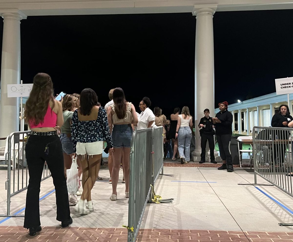 Wofford students stand in line at the Greek Village on Sept. 30. Students must have the barcode on their Presence app scanned to enter the Greek Village.