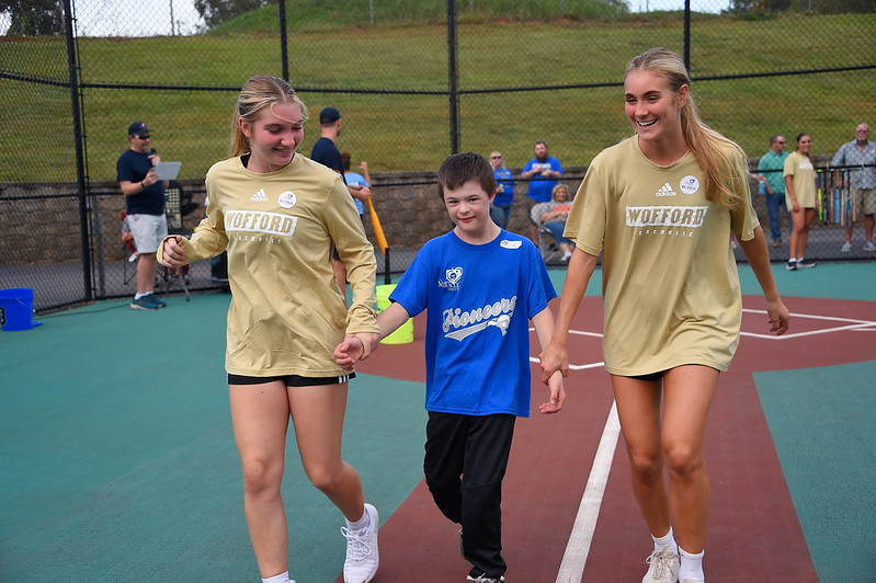 Members of the Wofford Lacrosse team visit Carolina Miracle League. The members played a game of baseball with the League.
