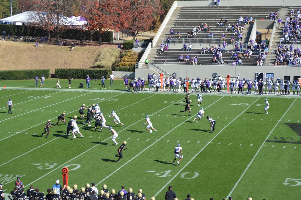 Running back Ryan Ingram ‘24 scored the first touchdown in the game against Furman on Nov. 18. The football win against Furman this year ended the Terriers’ season with a victory.