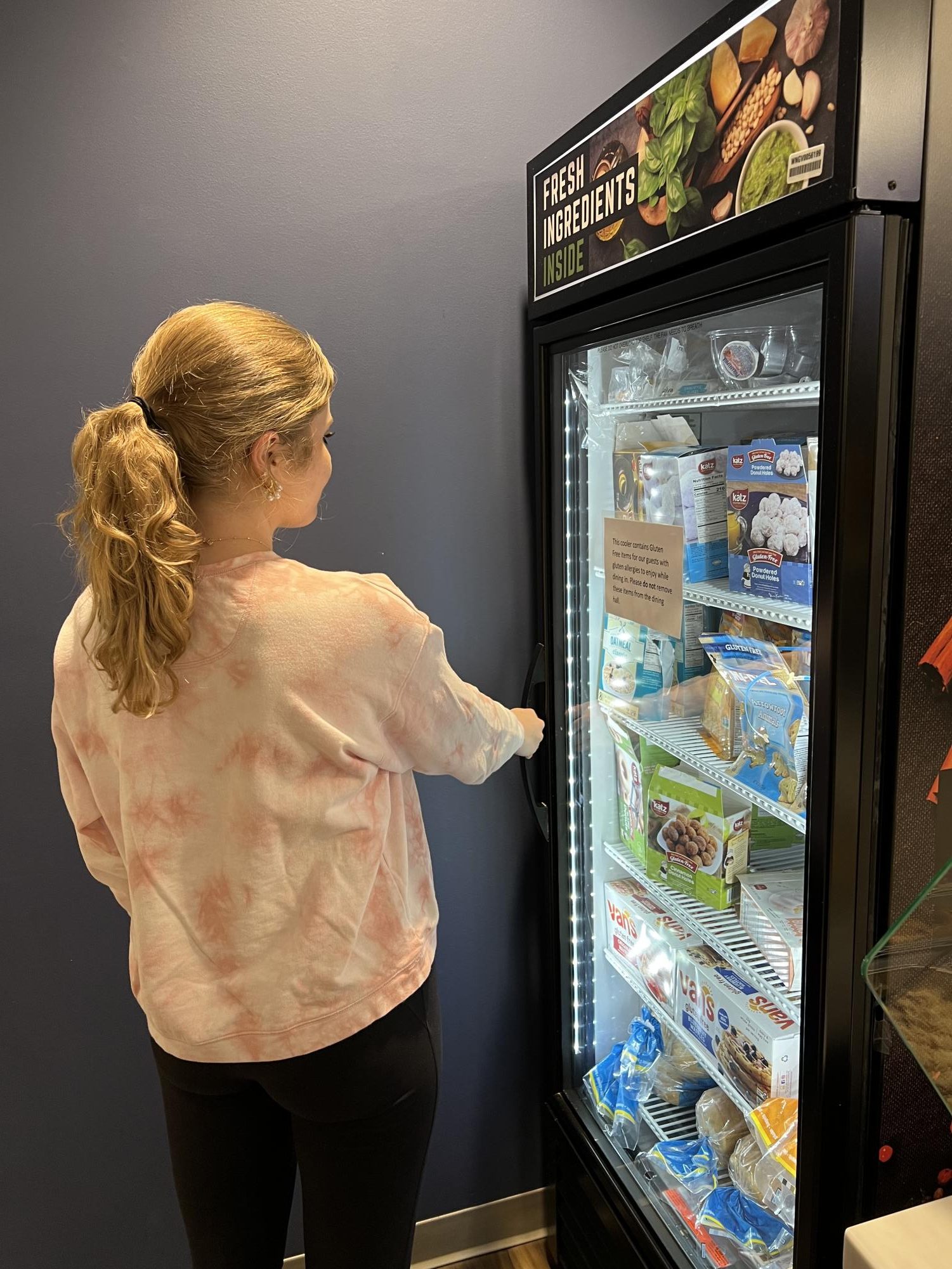 McNally Sowell ‘26 utilizes the gluten free refrigerator in Burwell dining hall. 
Burwell offers various food options for students that do not eat gluten.