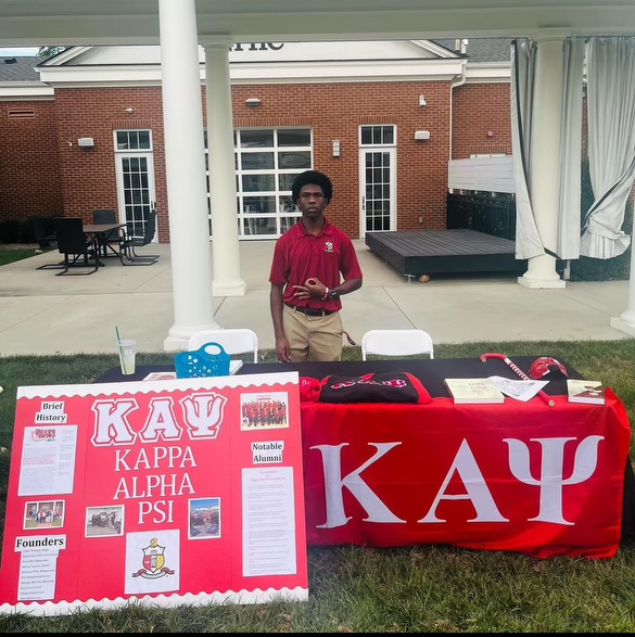 Photo courtesy of @nx_nupes on Instagram. Hayden Pendergrass ‘26 advertised Kappa Alpha Psi at the Greek Life interest fair last fall.
