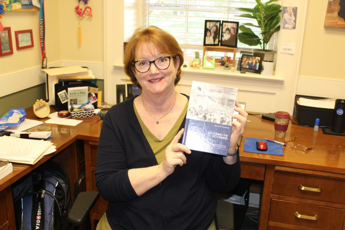 After many years of hard work, Dr. Rodrick published her book, Lecturing the Victorians: Knowledge Based Culture and Participatory Citizenship this past August. Dr. Rodrick poses with her book in her office in Main Building.