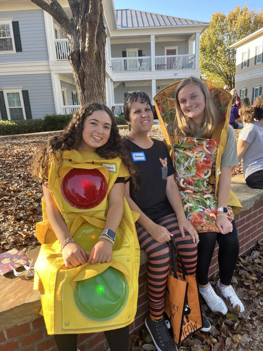 Students will soon celebrate trunk or treat this year. Members of Wofford companions sit together at last year's trunk or treat. 