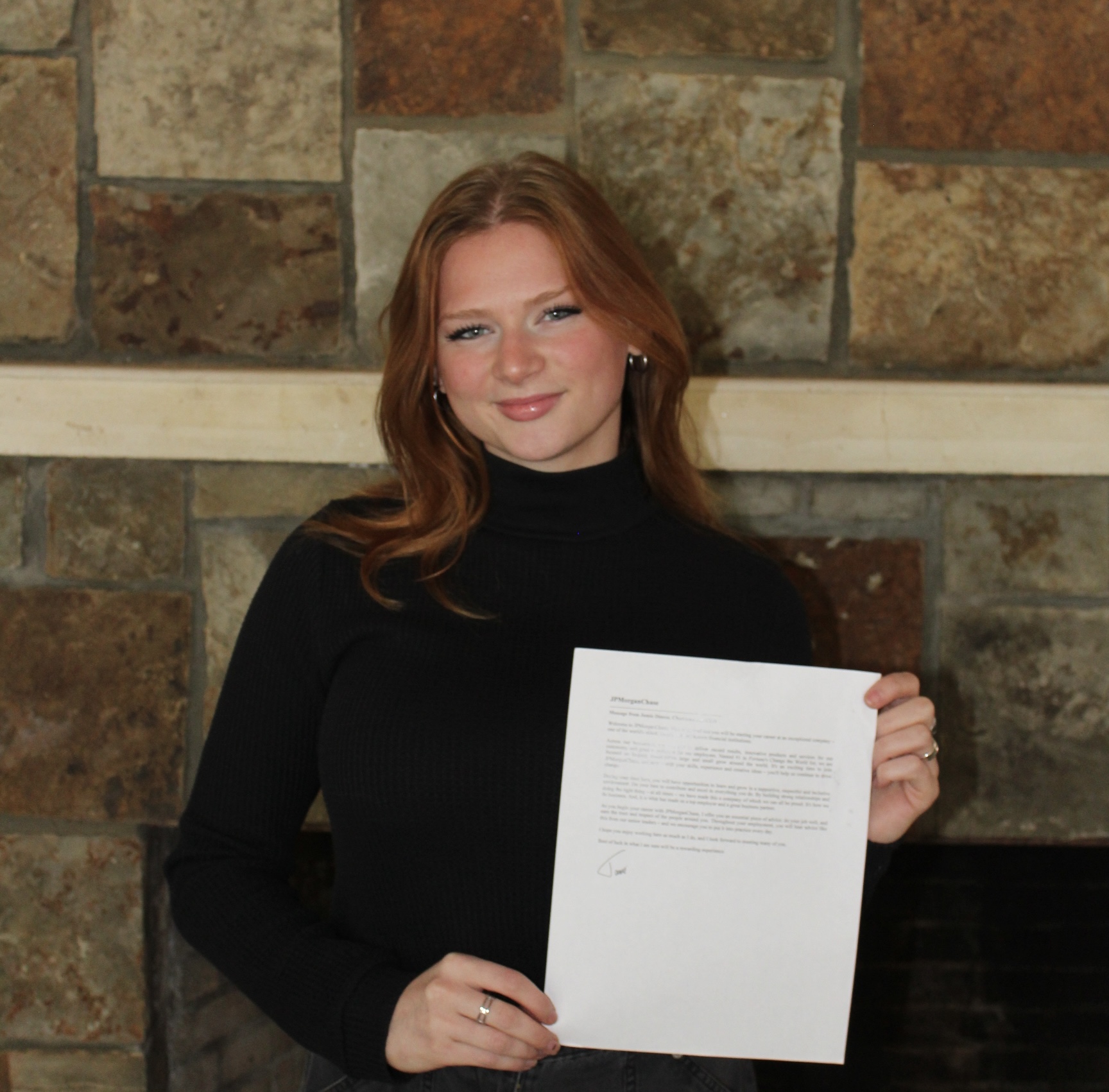 Avery Fields ‘26 poses with her official offer letter from JP Morgan. Fields secured
a highly competitive Commercial Banking Internship with JP Morgan.