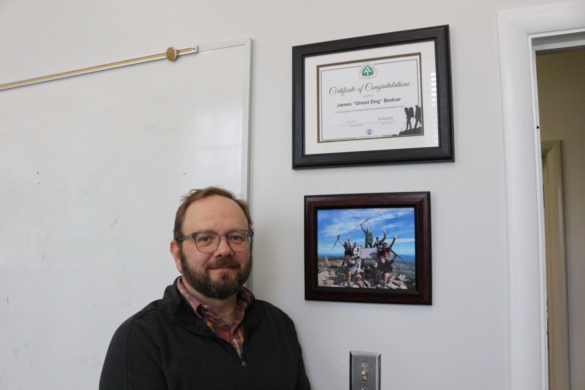In his campus office, Dr. Bednar reflects on hiking the Appalachian Trail with his dog.