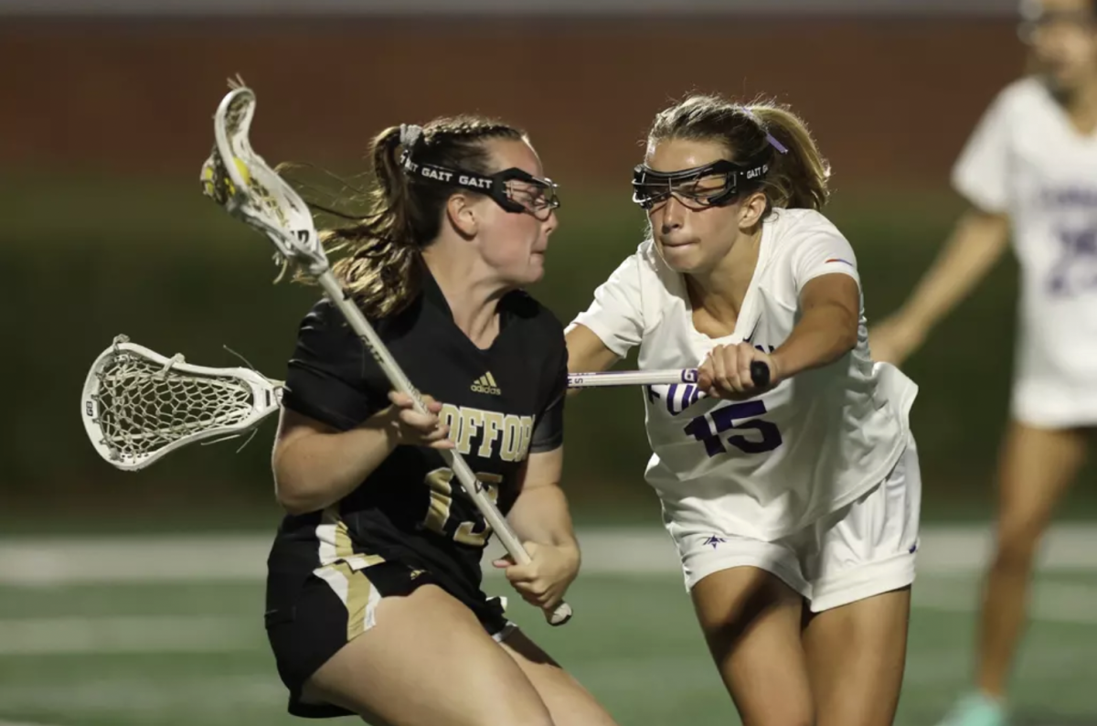 Ella Davis ‘27 cradles the ball on the field. Wofford Women’s Lacrosse beat Furman University for the first time in history two weeks ago.